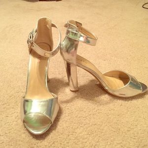 Cute, unique, versatile silver heeled sandals.